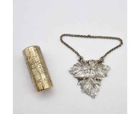 A Victorian silver cylindrical Scent Bottle (lacks stopper) engraved Bo Peep scene, London 1884, 2in high and a white metal '