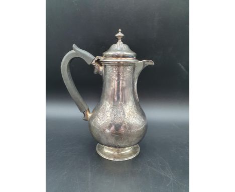 A Victorian silver baluster Hot water Jug with scroll engraving and Somerset crest of ducal coronet above portcullis, London 