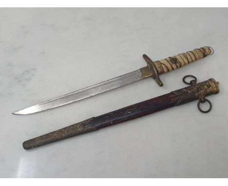 A Japanese Naval Dirk with single edged blade and shagreen wire bound grip in brass mounted leather scabbard A/F 1ft 4in L