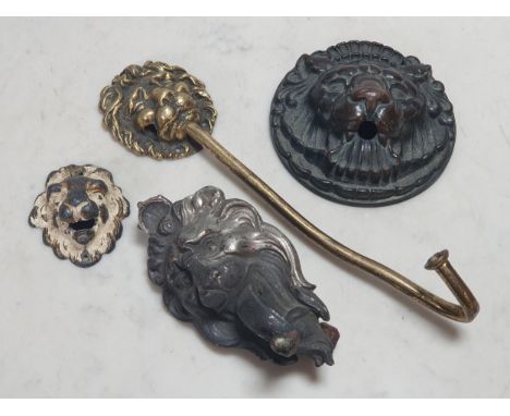 Four metal Fittings/Fixtures in the form of Lion Masks including a Doorbell, a Spout Face, a Wall Hook and a small gilt decor