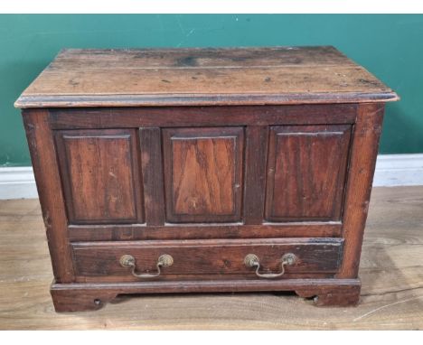 An 18th Century oak and elm Coffer Bach, the moulded top above three fielded panels, with single fitted drawer and raised on 