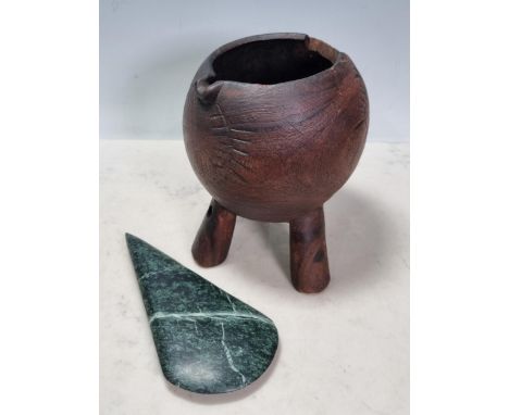 A Tribal hardwood Vessel/Jug with spout, carved line designs and raised on tapered tripod supports, A/F, 7"High, and a varieg