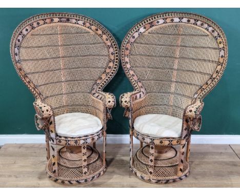 A pair of vintage wicker Large Peacock Highback Armchairs. Similar to chairs used in Emmanuelle Film in 1974