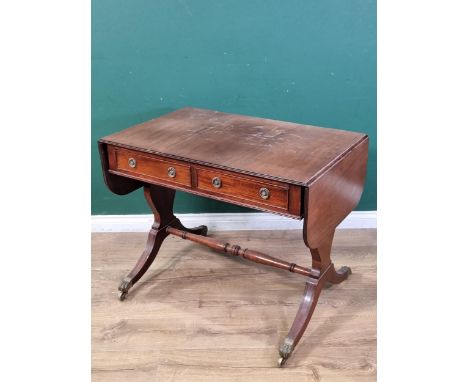 A 19th Century mahogany Sofa Table fitted two drawers on cheval frame with solid baluster end supports, down swept feet with 