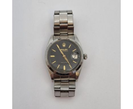 A gentleman's 1950's Rolex Oysterdate Precision Wristwatch the black dial with gold baton markers, sweep seconds hand and 'ro