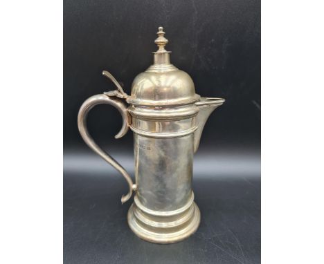 A George VI silver Flagon with domed lid having turned finial, flat thumb piece and scroll handle, Birmingham 1942, 710gms