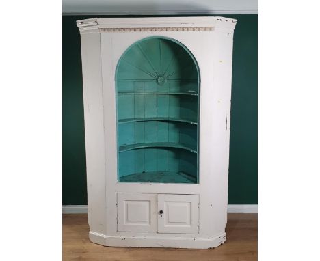 A Georgian pine barrel back Double Corner Cupboard with dentil frieze above shaped open shelves under architectural dome, pai