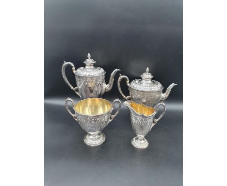 A Victorian silver four piece Tea and Coffee Service of classical urn form, finely engraved flowers and leafage, beaded rims,
