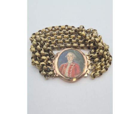 An early 19th Century Mourning Bracelet painted portrait miniature on ivory of gentleman in red court suit to clasp, 26mm x 3