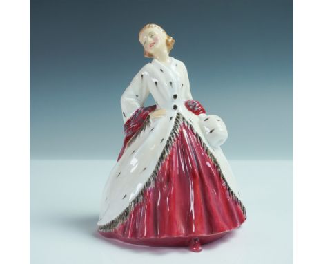 This Royal Doulton figurine captures the elegance of classic fashion with a striking white coat adorned with black spots and 