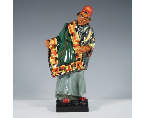 Striking Royal Doulton figurine titled Carpet Seller, HN1464, closed hand, exquisitely crafted in fine bone china. Designed b