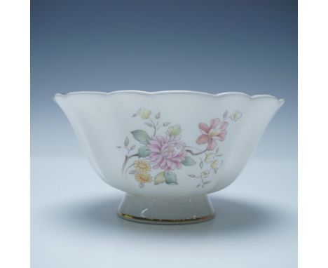 Fine bone china bowl signed by Michael Doulton in 1987. The exterior showcases a floral design with pastel-colored flowers an