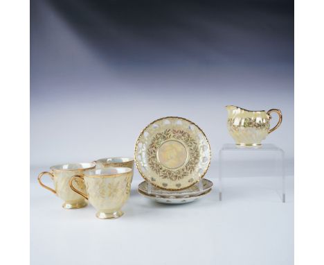 A beautiful Japanese tea set featuring an opalescent finish accented with intricate gilt floral patterns. This set includes 3
