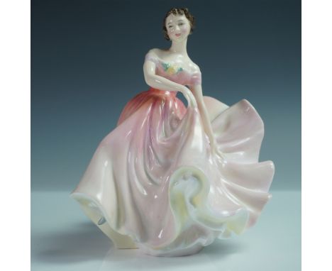 This Royal Doulton figurine, titled The Polka (HN2156), depicts a graceful young woman mid-dance, elegantly lifting the folds