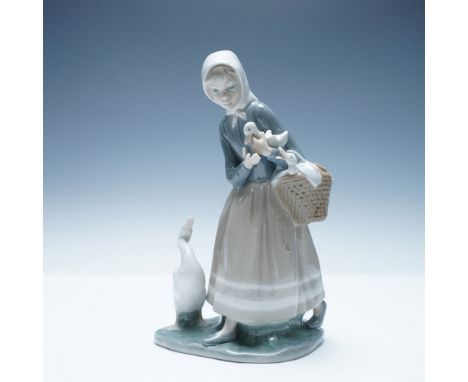 Charming Lladro porcelain figurine titled Shepherdess with Ducks (#1004568), sculpted by Fulgencio Garcia and issued in 1969.