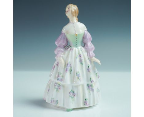 Part of the Harradine Classics series, is this refined figure in a tiered cream dress adorned with delicate floral motifs, th
