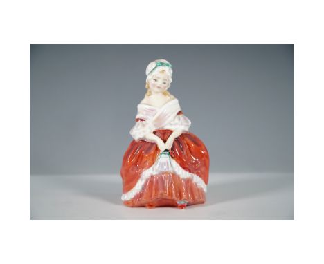 From the Harradine Child Classics series, this figurine depicts a young woman dressed in a striking red and white gown, grace