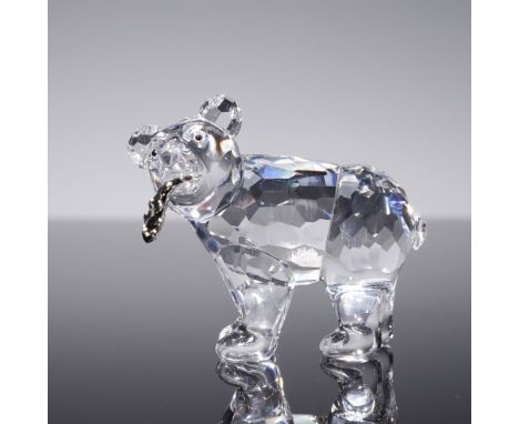 Adorably crafted in faceted clear crystal, this Swarovski Grizzly Cub figurine captures a moment of playful curiosity. Design