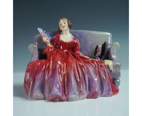 This Royal Doulton figurine, titled Sweet &amp; Twenty (HN1298), depicts a young woman elegantly dressed in a flowing red and