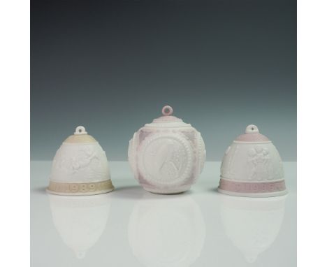 This set of three Lladro bisque porcelain annual Christmas ornaments includes two bell-shaped ornaments from 1989 and 1996 an