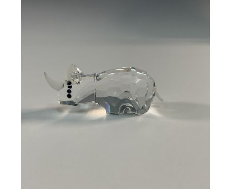 Part of the African Wildlife group. This Swarovski crystal rhinoceros figurine features faceted clear crystal with frosted cr