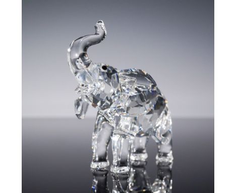 Swarovski Silver Crystal figurine Baby Elephant (191371) is crafted in clear faceted crystal with a raised trunk symbolizing 