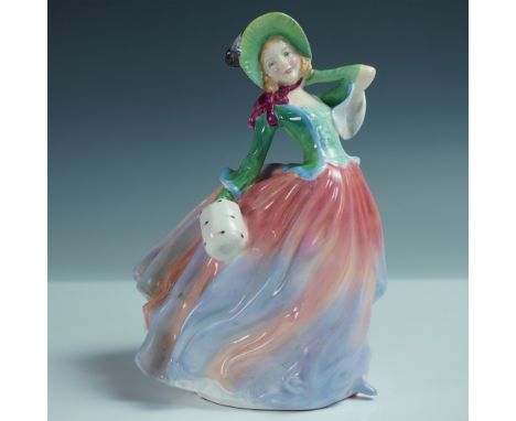 This Royal Doulton figurine, Autumn Breezes HN1911, depicts a charming woman elegantly bracing against the wind in a flowing 