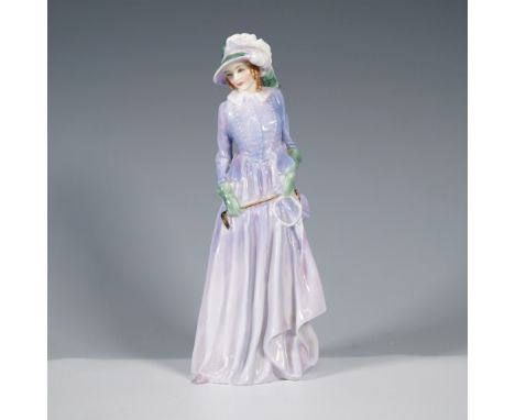 Part of the Harradine Classics series, this elegant figurine portrays a refined lady in a flowing lavender dress, accented wi