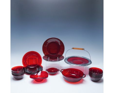 A striking 20-piece collection of vintage ruby glass dinnerware, radiating timeless charm and sophistication. This deep red g