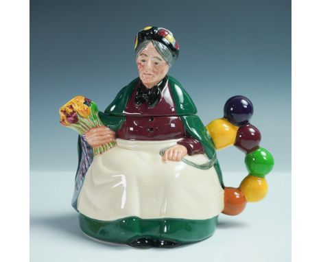 Royal Doulton teapot featuring the Old Balloon Seller, inspired by one of the brandâ€™s most iconic figures. This ceramic tea