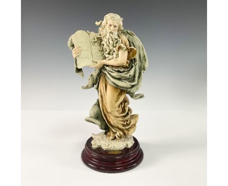 This remarkable sculpture by renowned artist Giuseppe Armani depicts Moses holding the Ten Commandments. Crafted with excepti