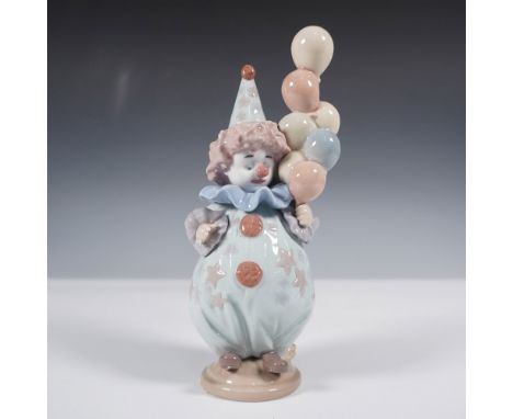 Charming Lladro porcelain figurine titled Littlest Clown (5811), sculpted by Antonio Ramos. This delightful piece depicts a y