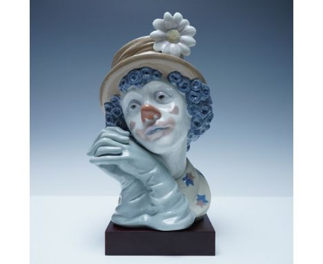 Exquisitely crafted Lladro porcelain budy titled Melancholy, model number 1005542. This beautifully sculpted piece captures t