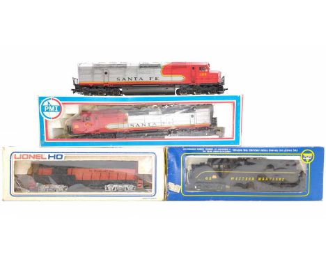 Three HO American diesel locos and one non-powered trailer: PMI 6600 Santa Fe (E-BE) with unboxed unpowered trailer (VG); AHM