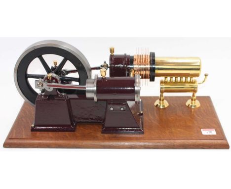 A very well made Large scale Hot Air engine, comprising of maroon body and set up for Spirit Fired Use, powering a large 7" s