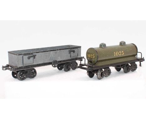 1920s Bing light grey bogie coal wagon with side drop down doors (G-VG), with a 1920s grey bogie tanker 1025 (AV-G)