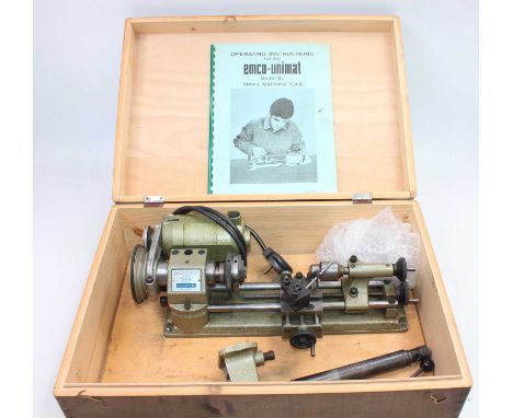 EMCO Unimat Model SL small machine tool, housed on a wooden display plinth, and housed in a wooden box, with operating instru