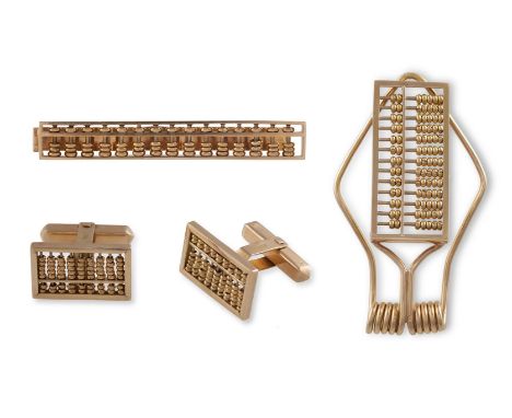 A GENTLEMAN'S GOLD DRESS SETEach designed as an abacus, the set includes a pair of cufflinks, a money clip and a tie clip, ea