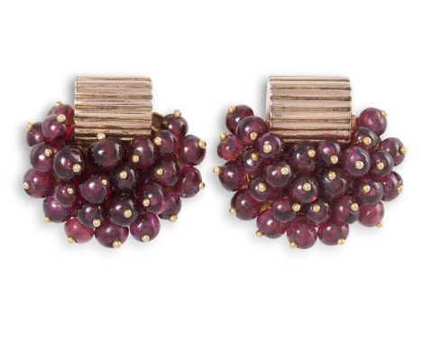 A PAIR OF GARNET EARCLIPS, CIRCA 1940Each earclip designed as a cluster of grapes, set with ruby cabochons with polished sphe