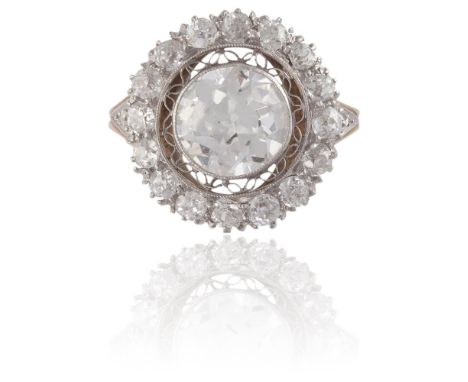 A DIAMOND CLUSTER RINGThe old brilliant-cut diamond weighing approximately 1.80cts, within a surround of similarly-cut diamon