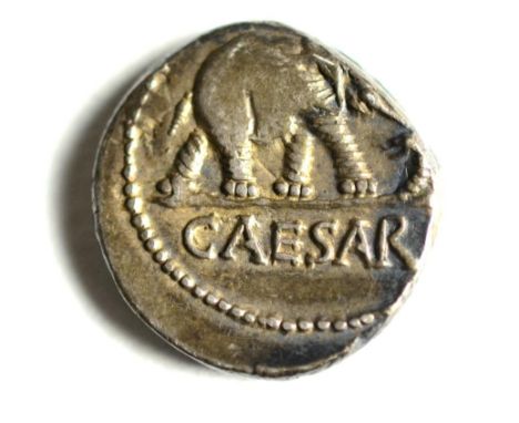 Roman Imperial: Julius Caesar Silver Denarius: obv. beaded circle around elephant trampling on dragon, CAESAR in ex, rev. emb