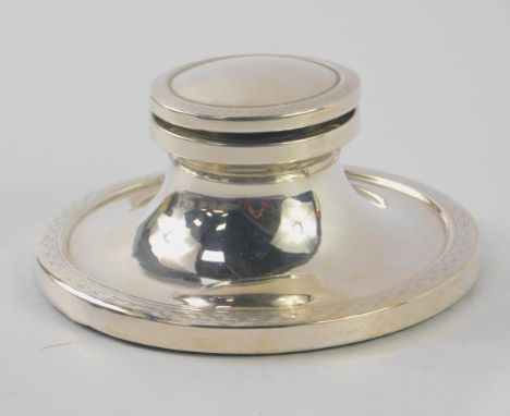 A George V silver loaded capstan inkwell, with engine turned decoration, glass insert, Birmingham 1926, 6.52oz total weight.