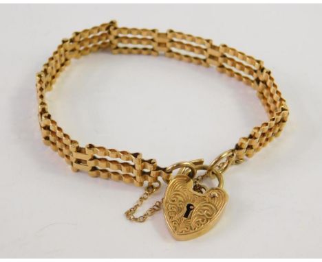 A 9ct gold three bar gate link bracelet, as fitted, 12.1g.