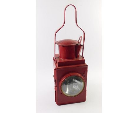 A red painted railway lantern, stamped BR (M), 50cm high.
