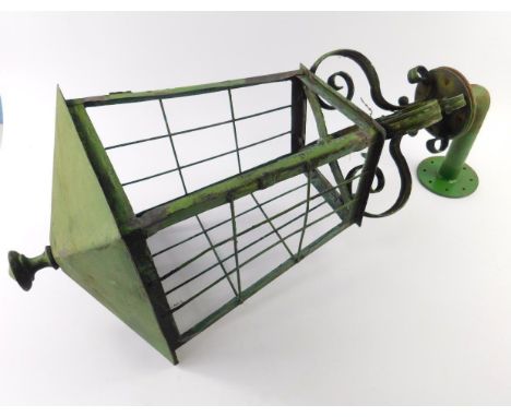 A green painted iron exterior wall lantern, 70cm high.