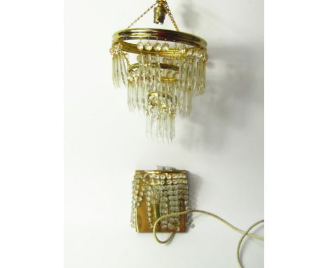 Four three tier brass chandeliers, with faceted cut glass drops, further chandelier and a wall light.