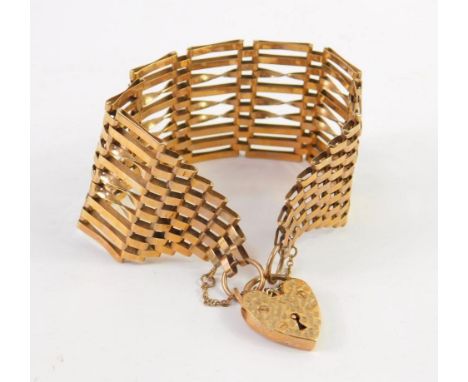 A 9ct gold nine bar gate link bracelet, on a heart shaped padlock clasp, with safety chain as fitted, 20.3g.