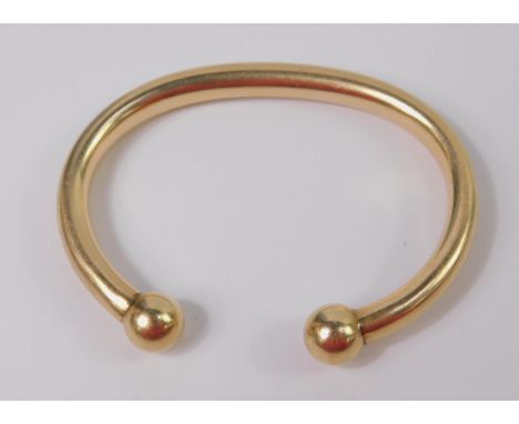 A 9ct gold torc bangle, 49.5g.