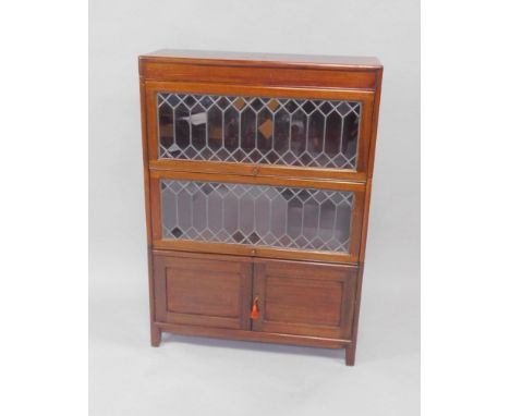 A Globe Wernicke style mahogany bookcase, with two lead glazed fronted sections above cupboards, raised on straight legs, 87c