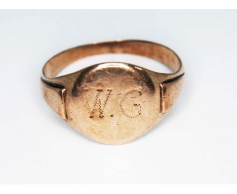 A yellow metal signet ring, monogrammed 'W.G', wt. 3.5g. Size R P&P within UK £8+VAT